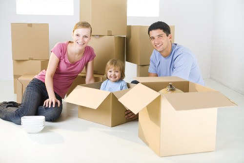 People preparing boxes for Chelsea removals in a residential London home
