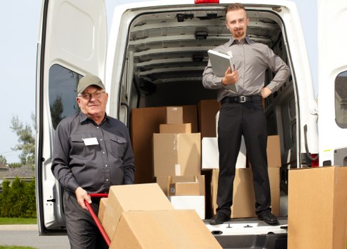 Moving van and boxes prepared for a Chelsea home removal