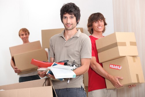 Packed boxes and wrapped furniture ready for a home move in Chelsea