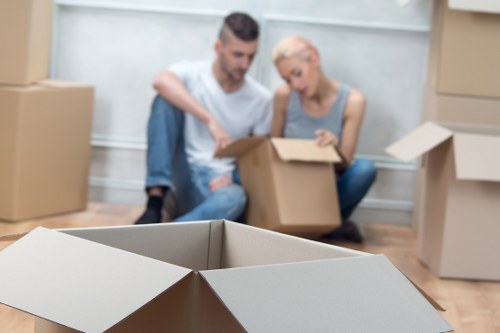 Local movers organising boxes for a Chelsea apartment move