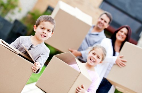 Staff using proper lifting techniques during a house move