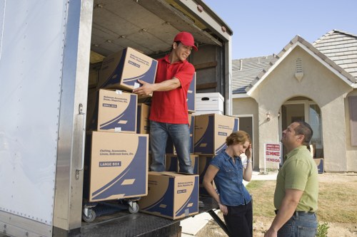 Organised removal vehicle loaded with secured boxes and furniture