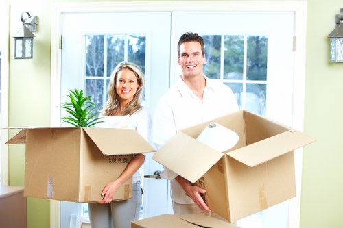 Office equipment and furniture being carefully handled for a Chelsea move