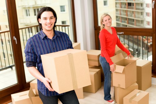 Professional mover handling items in a Chelsea street with parking challenges